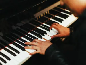 Overhead view of a pianists hands on a piano keyboard