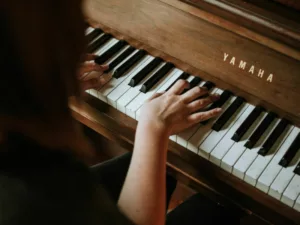 An overhead shot of a woman playing piano.