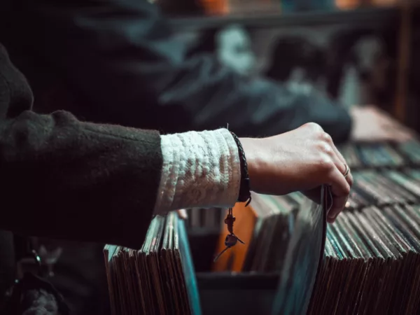 Flipping through a collection of jazz records.