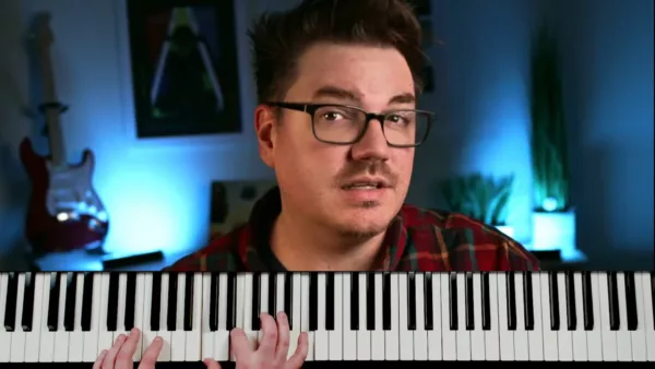 Josh Walsh teaching jazz piano online in a video studio